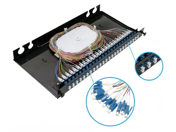 Rack-mounted ODF with slide-out splice trays showing fusion-spliced pigtails and fiber routing channels
